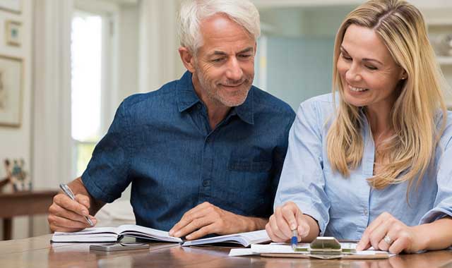 Aging-Infographic-Blog two older adults reviewing information at a table