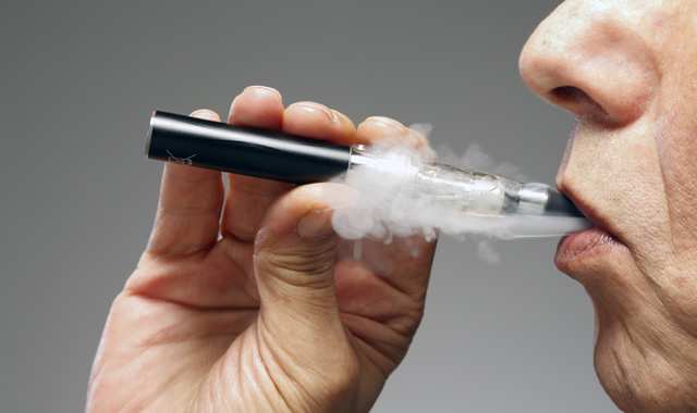 person using an electronic cigarette