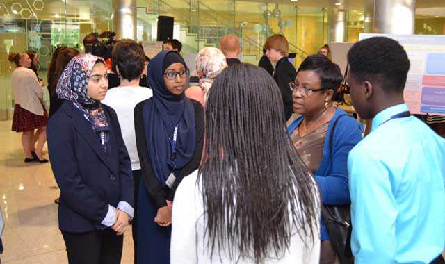 STEM-opioid-showcase-blog students discussing their projects