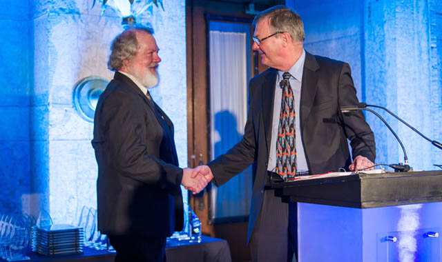Steve Risser receiving award from CEO Jeff Wadsworth
