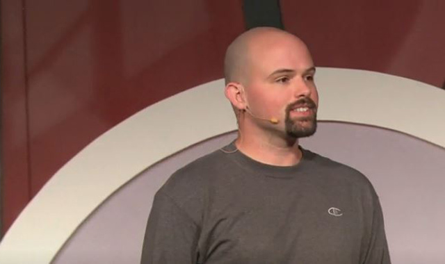 Chris-Domas-TEDx-screenshot Chris Domas on stage presenting during an event