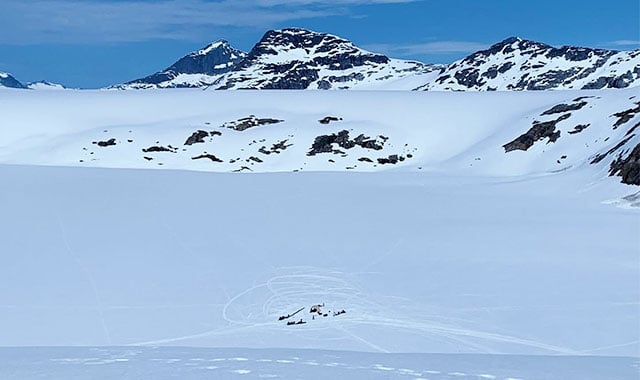 alt=landscope shot of the jirp base with the alaskan glacier in the background