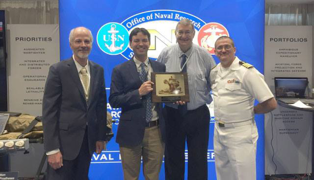 Battelle and officials from Office of Naval Research pose for photo