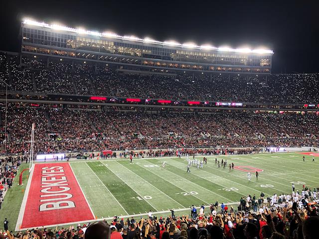 Photo:  Night view of the OSU Stadium with the Ohio State Buckeyes football team