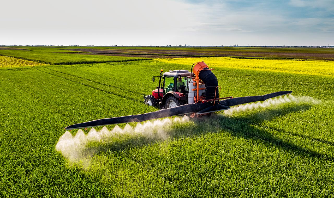 tractor spraying field