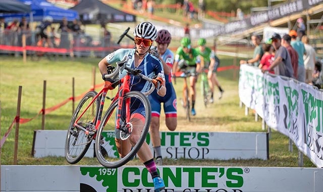 alt= Battelle data scientist Jen Malik competing in a cycling race
