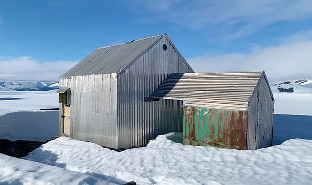 alt= landscape shot of the hut matt zeglen and andrew matas lived in during their time in jirp