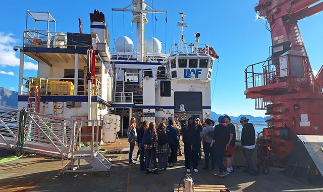 alt= stem students from multiple communities across the Kenai Peninsula Borough School District, on a boat to the amped on energy camp