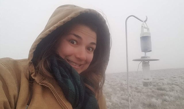 alt= Kremidas setting an off-season NEON mosquito trap in frigid weather in Colorado (2019).